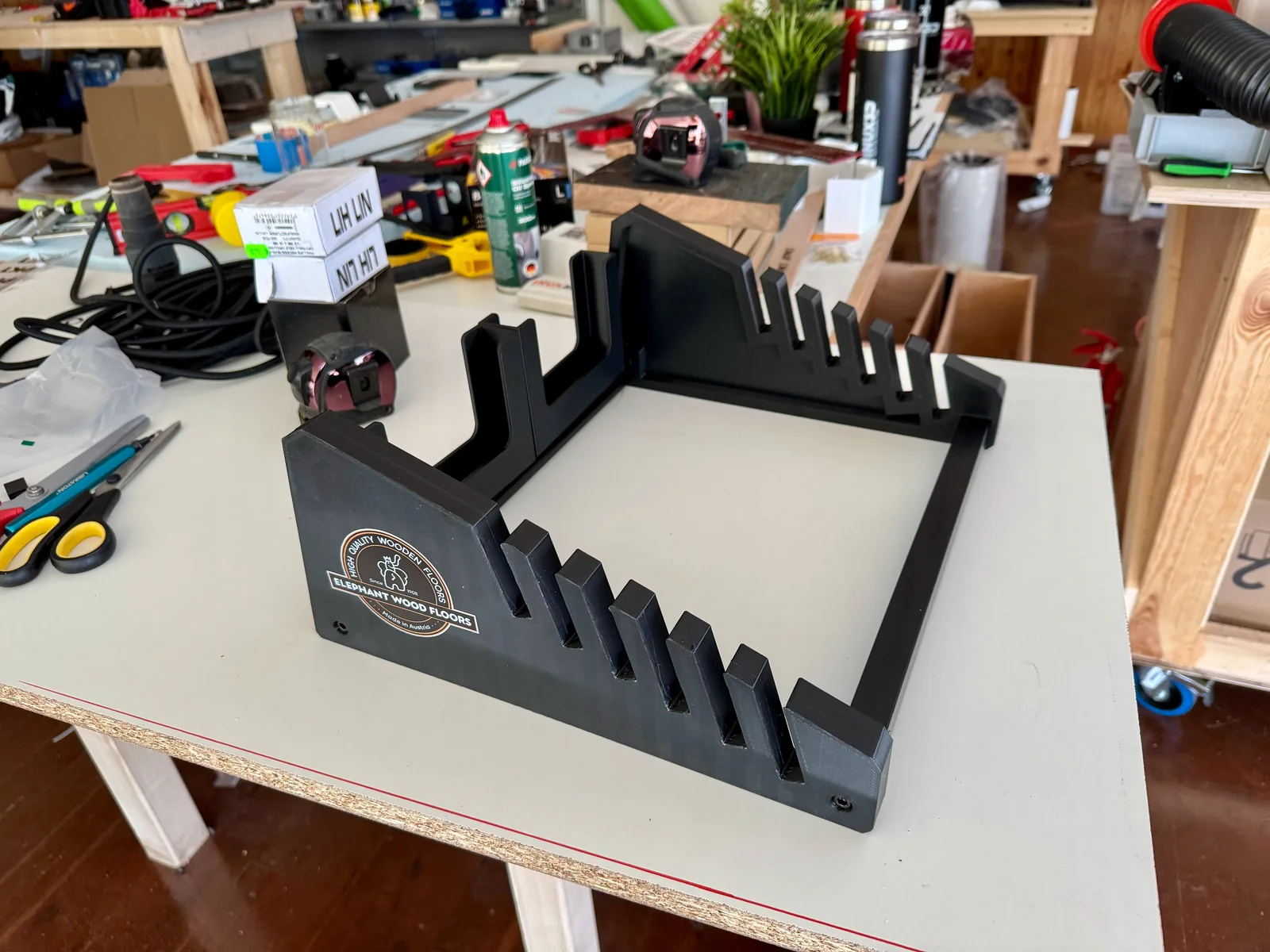 Client-branded flooring sample display stand, 3D printed in black