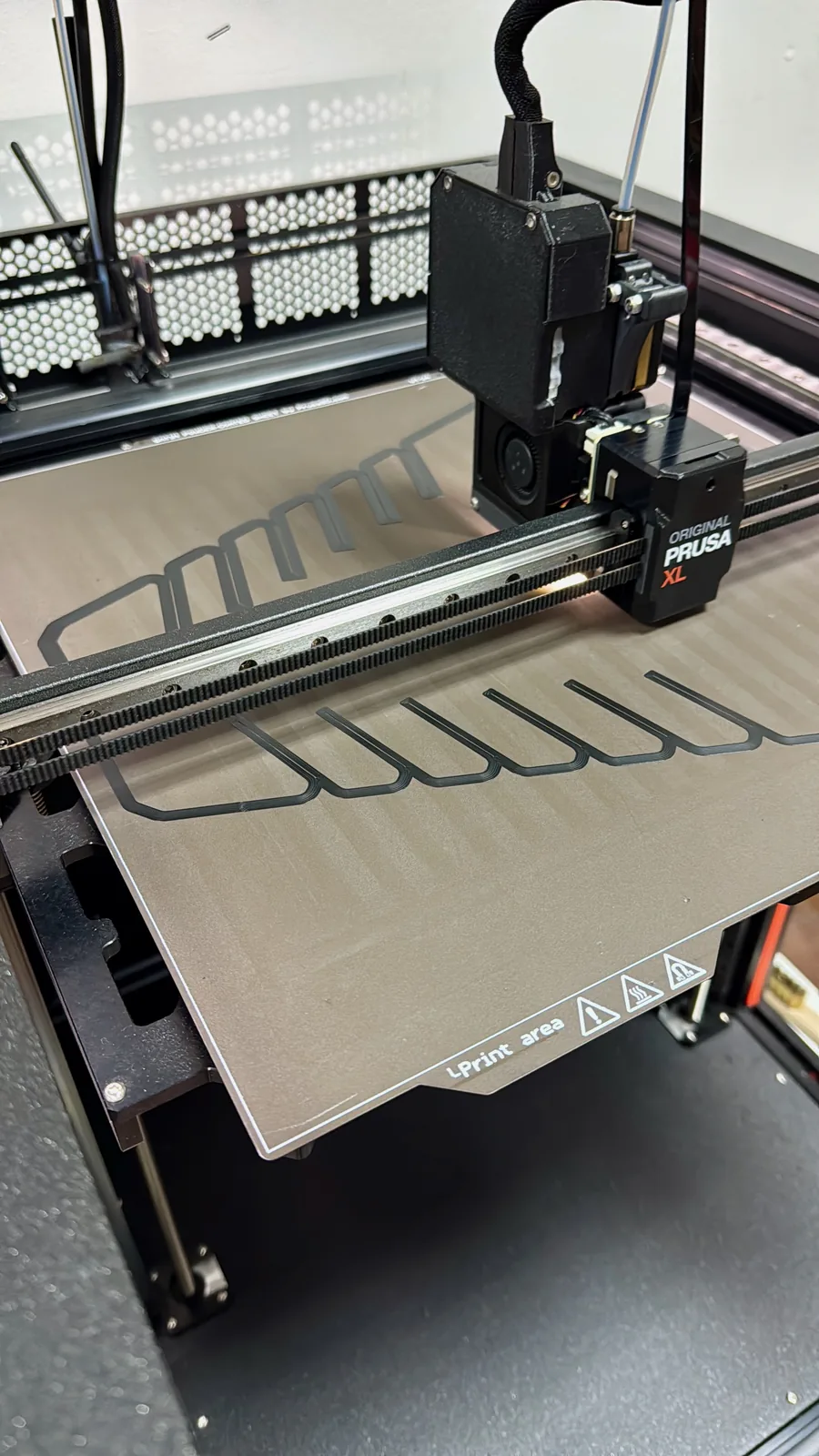 Prusa XL printing a batch of mounting clips on the Larnaca print farm