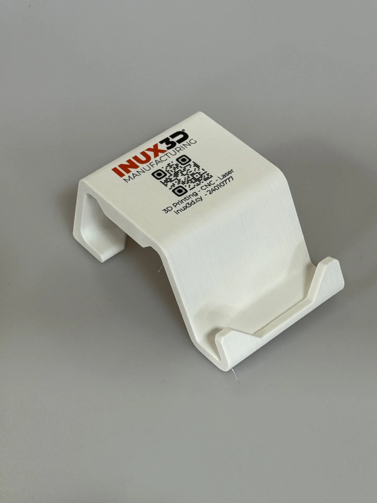 Full-colour logo and QR code UV printed directly onto a 3D printed phone stand